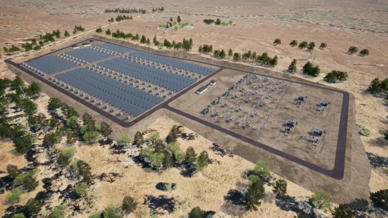 Aerial view of a solar power facility in a dry, grassy area with rows of solar panels and electrical equipment, surrounded by scattered trees and open land.